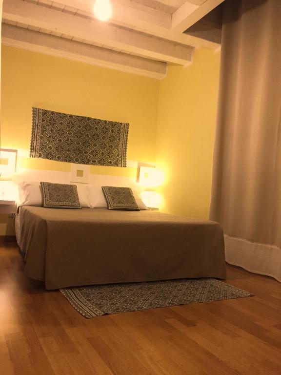 Postel nebo postele na pokoji v ubytování RESIDENZA SERENA B&B -Centro Storico