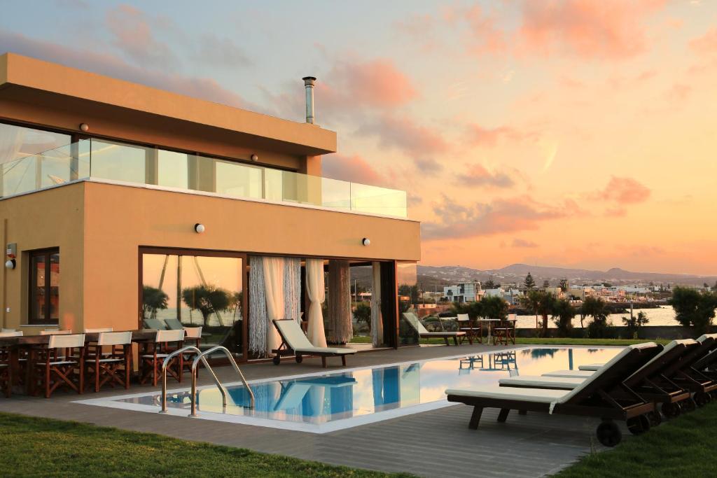 a rendering of a house with a swimming pool at Kimona Villa Seafront Swimming Pool Jacuzzi 6 Bedrooms 21 PAX Kouvohori Villas Crete in Kokkíni Khánion