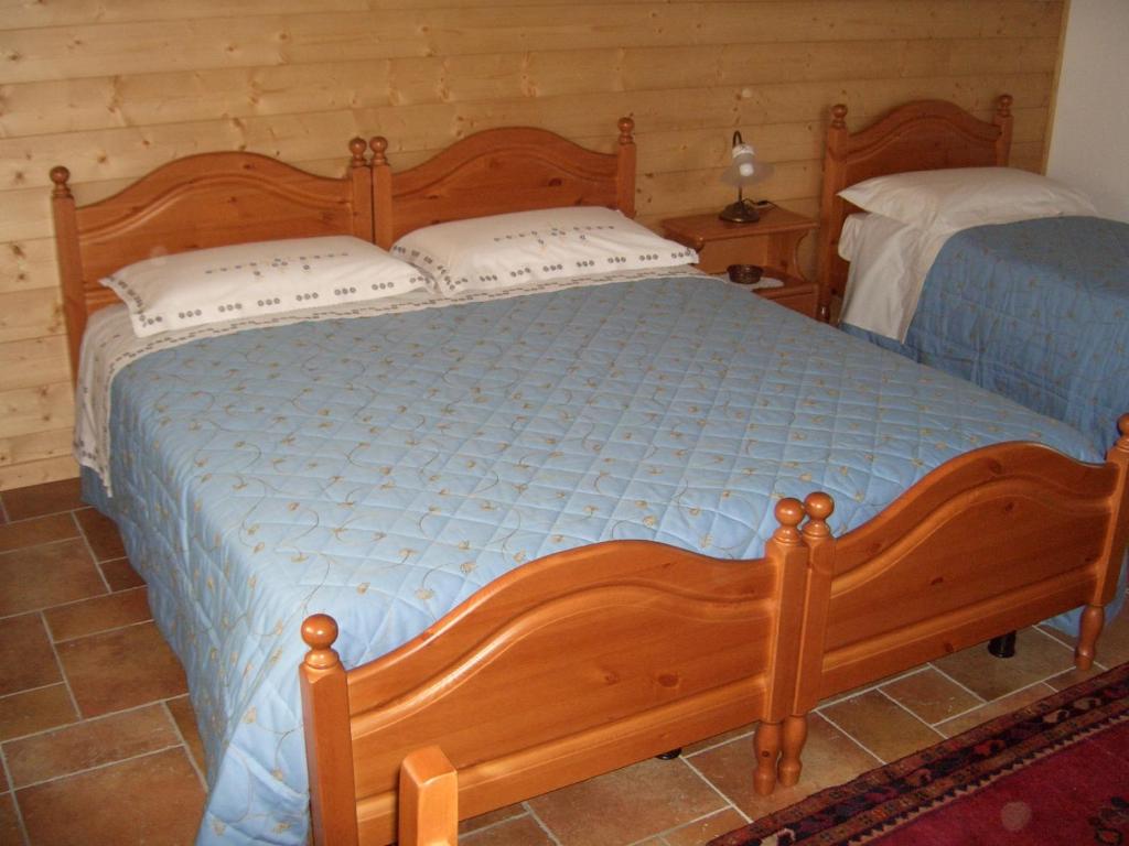 Postel nebo postele na pokoji v ubytování B&B SCACCIA PENSIERI