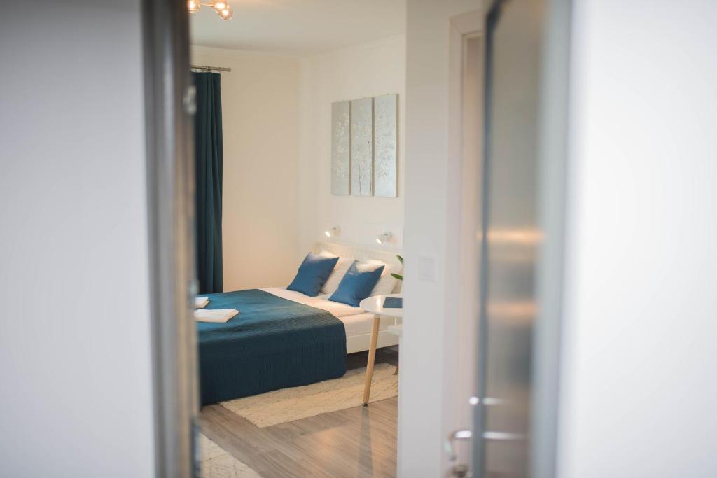Postel nebo postele na pokoji v ubytování Rába Apartman House