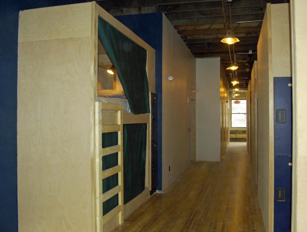 a hallway with a room with a bunk bed at Hostel du Nord in Duluth