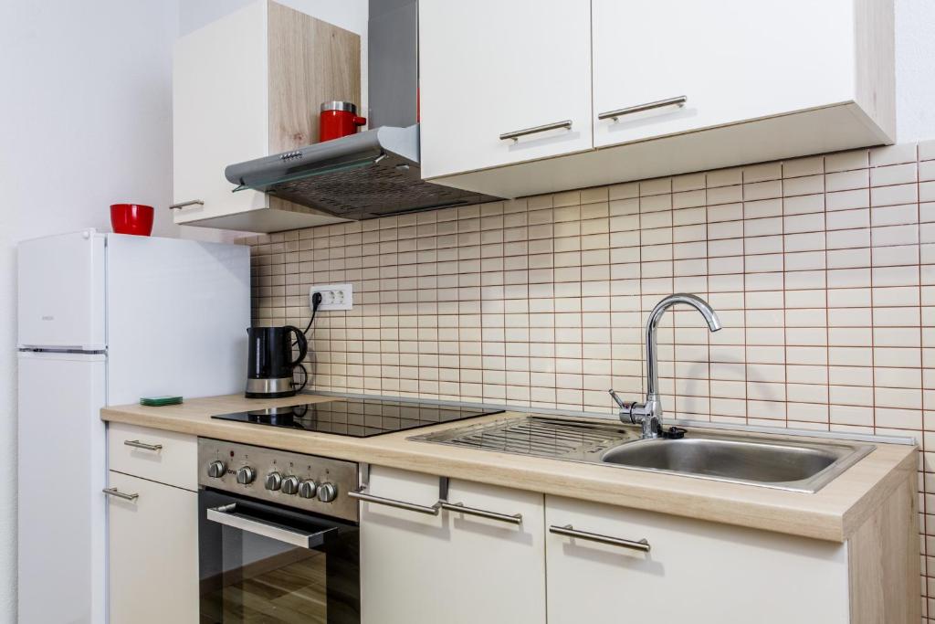 Kuchyň nebo kuchyňský kout v ubytování Apartments Franičević