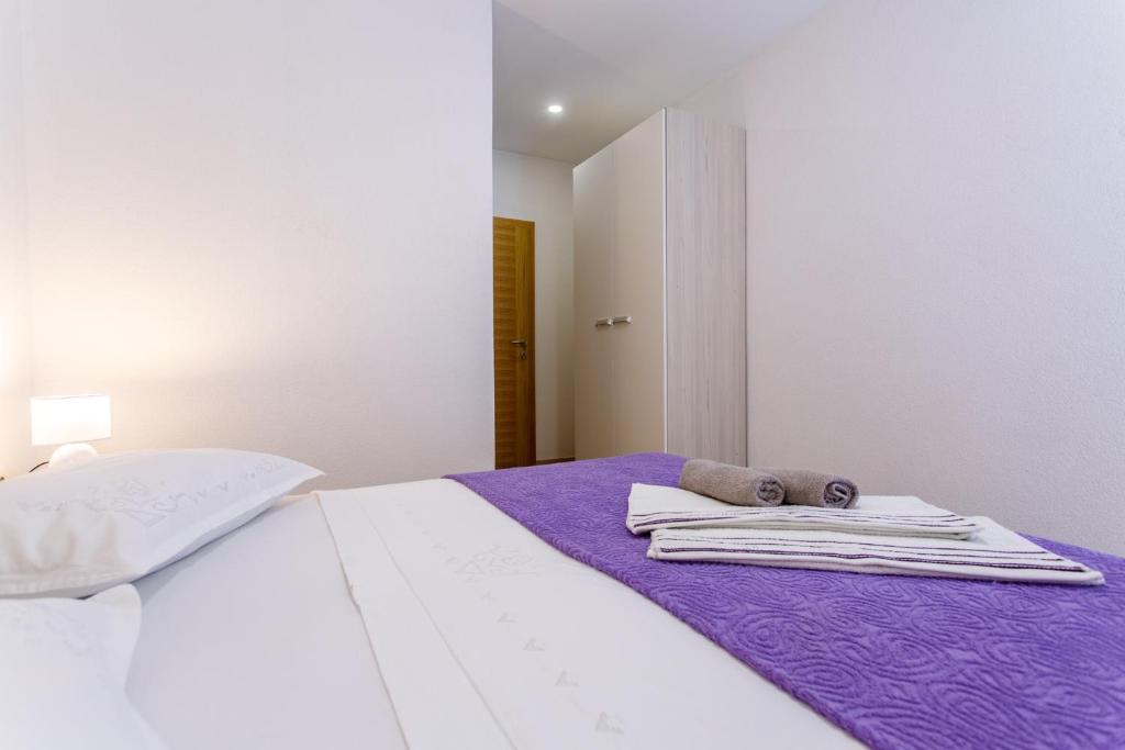 Postel nebo postele na pokoji v ubytování Apartments Franičević
