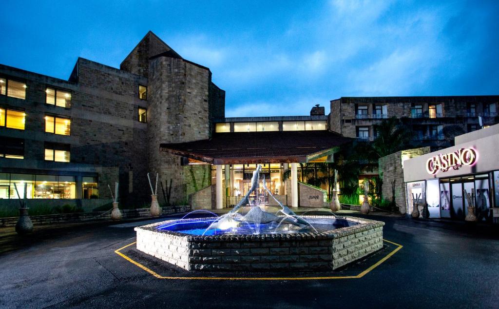 a large fountain in front of a building at Avani Lesotho Hotel & Casino in Maseru