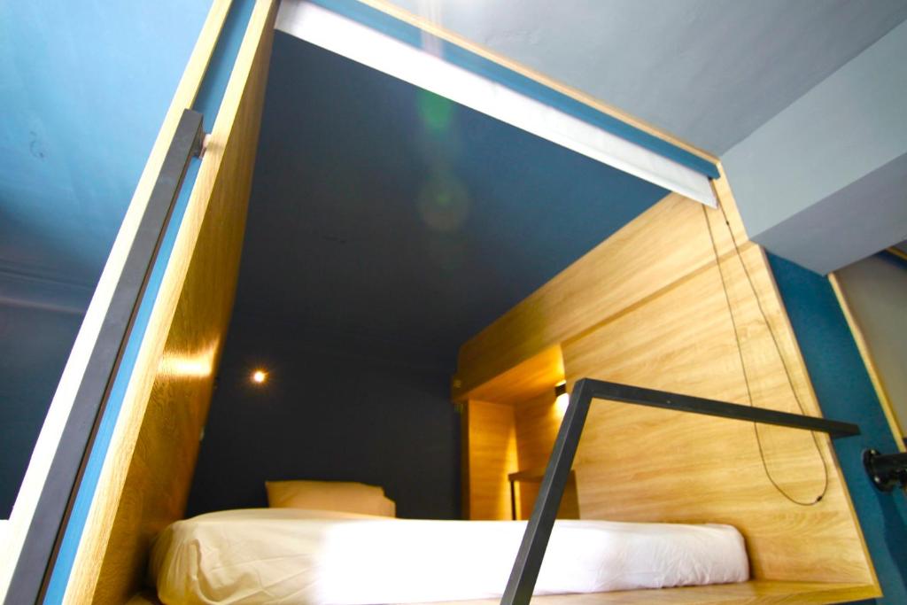 Postel nebo postele na pokoji v ubytování DONGMEN 3 Hostel