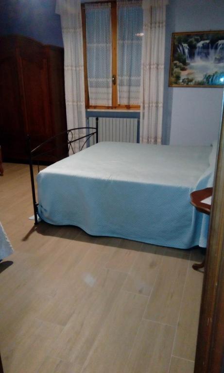 A bed or beds in a room at AGRITURISMO NIZUR'IN