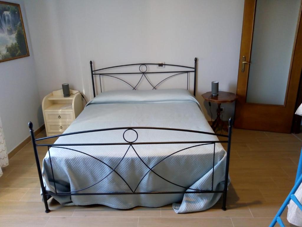 A bed or beds in a room at AGRITURISMO NIZUR'IN