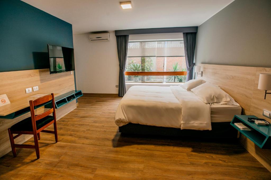 Postel nebo postele na pokoji v ubytování Daniel's Apart Hotel