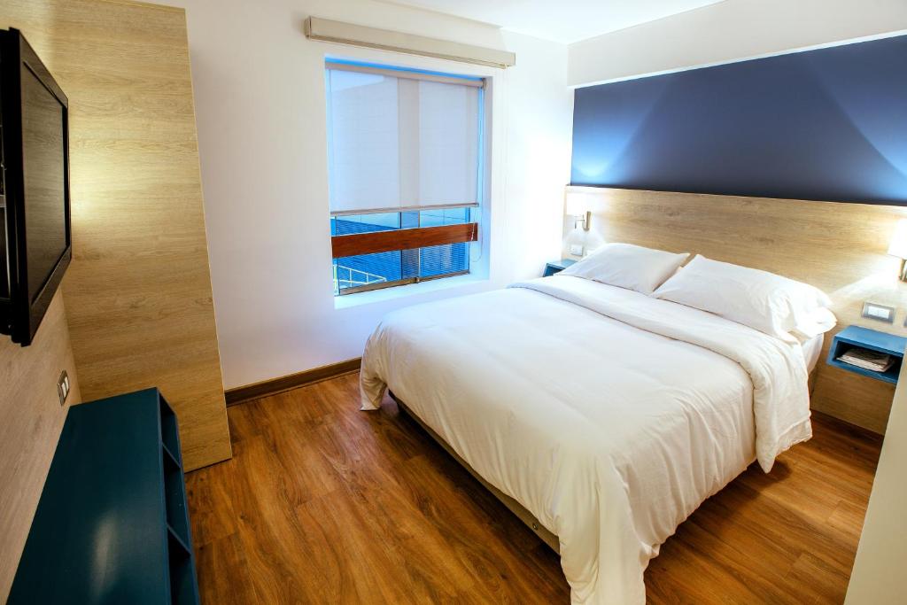 Postel nebo postele na pokoji v ubytování Daniel's Apart Hotel