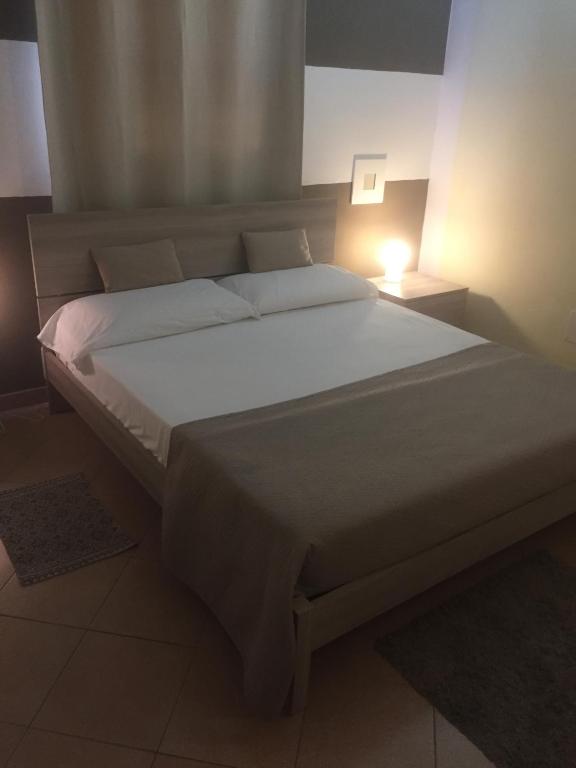 Postel nebo postele na pokoji v ubytování RESIDENZA SERENA B&B -Centro Storico