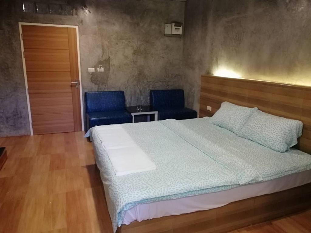 Postel nebo postele na pokoji v ubytování Sands Place Apartment and Hotel