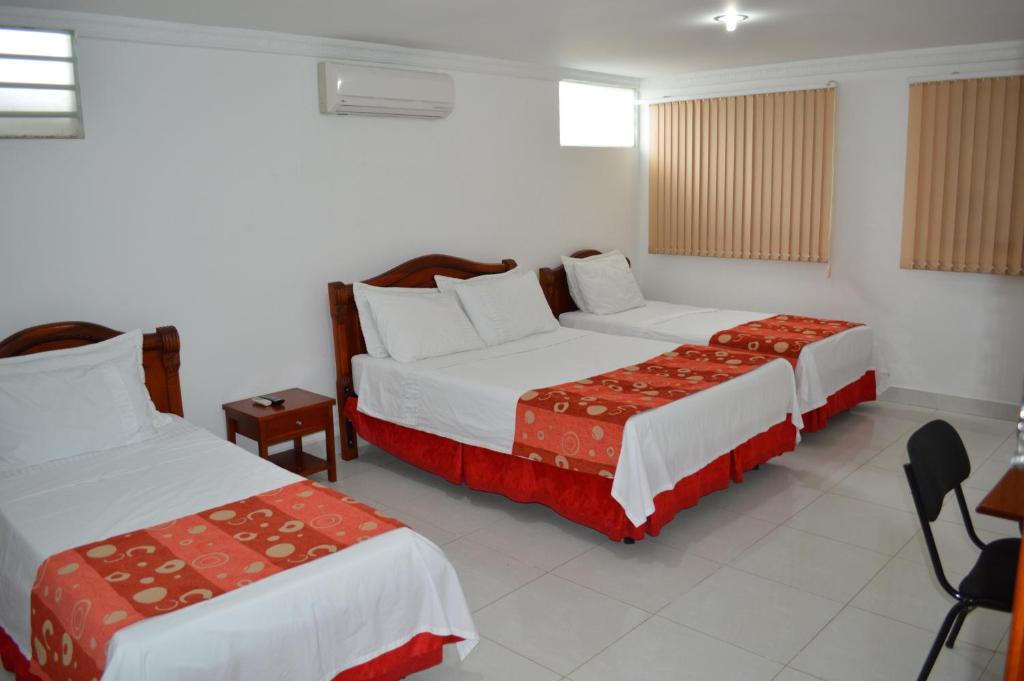 Postel nebo postele na pokoji v ubytování Hotel D' Leon Inn