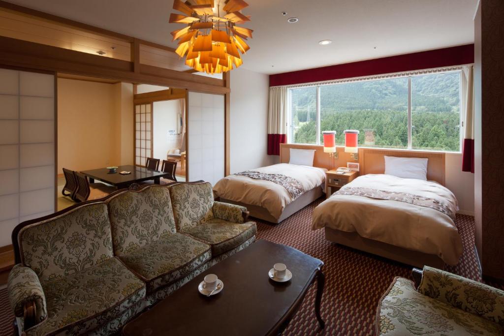 Postel nebo postele na pokoji v ubytování Hotel Morinokaze Tateyama‎