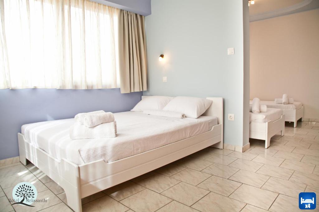 Postel nebo postele na pokoji v ubytování Hotel Melissanthi