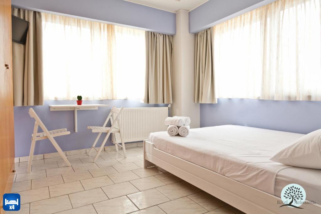Postel nebo postele na pokoji v ubytování Hotel Melissanthi