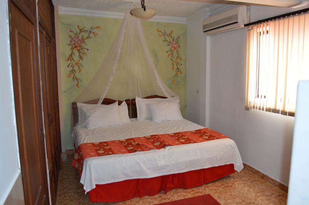 Postel nebo postele na pokoji v ubytování Hotel D' Leon Inn