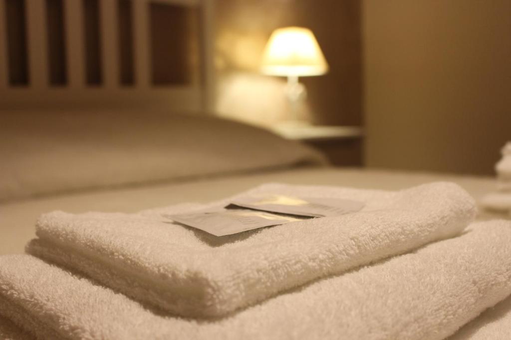Łóżko lub łóżka w pokoju w obiekcie B&B Villa dei Cigni Reali