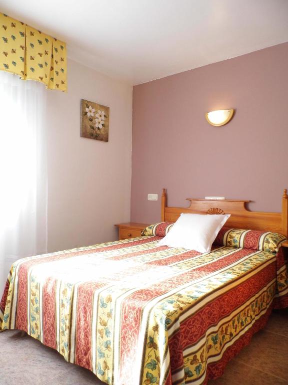 Postel nebo postele na pokoji v ubytování Hotel Arboleda