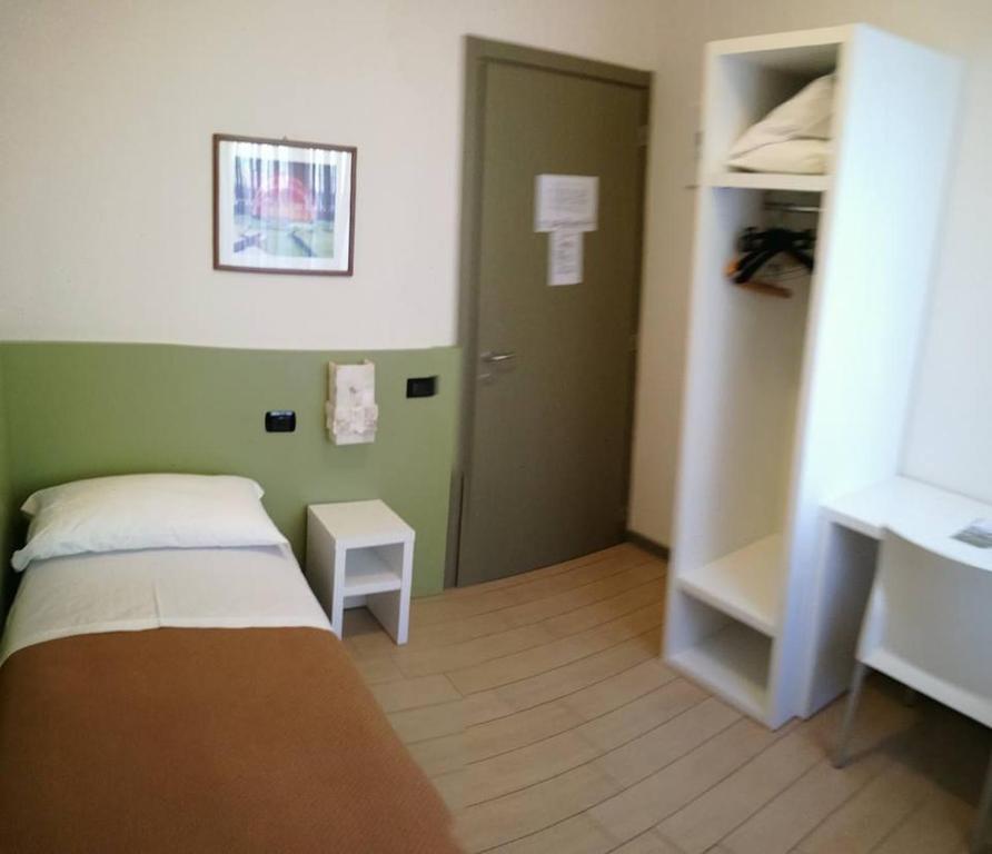 Postel nebo postele na pokoji v ubytování Da Gianni Hotel
