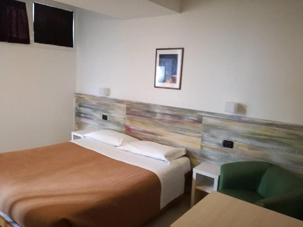 Postel nebo postele na pokoji v ubytování Da Gianni Hotel
