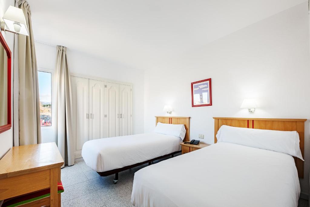 Postel nebo postele na pokoji v ubytování Apartamentos LIVVO Koala Garden
