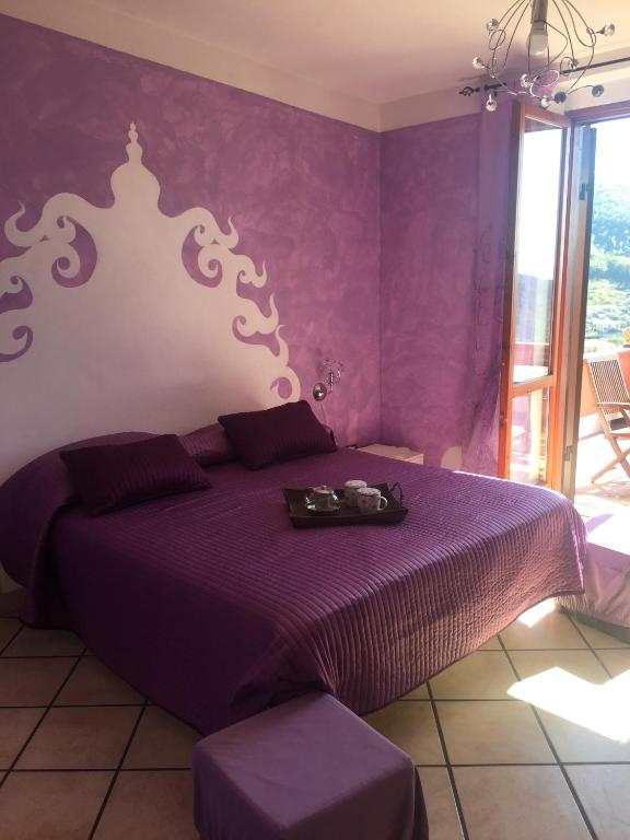 A bed or beds in a room at Villa Fernanda