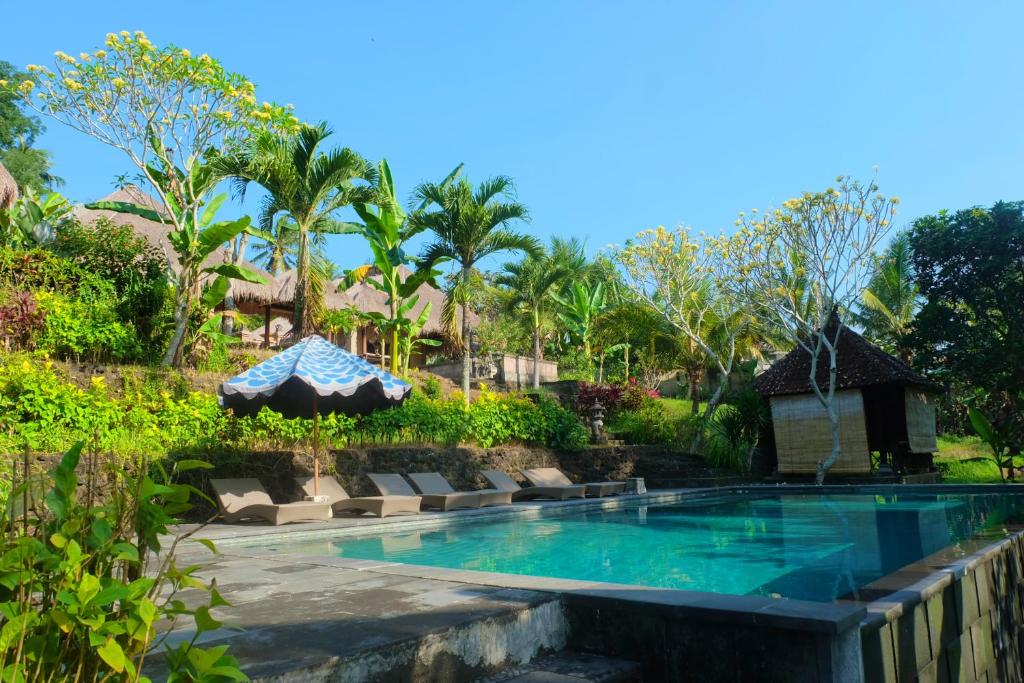 Bazén v ubytování Puri Taman Sari Resort nebo v jeho okolí