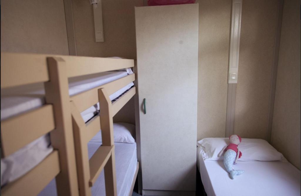 Postel nebo postele na pokoji v ubytování Camping Sènia Tucan