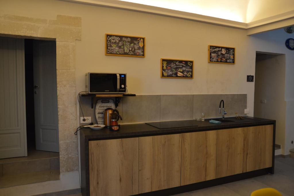 Kuchyň nebo kuchyňský kout v ubytování Lucernaio Rooms