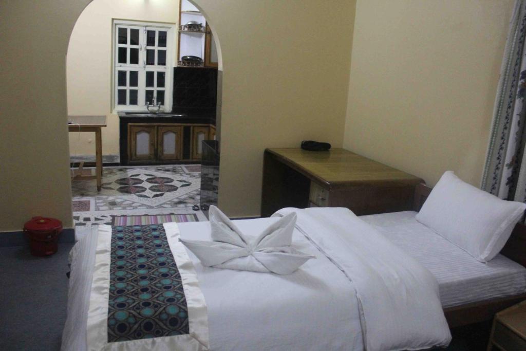 Postel nebo postele na pokoji v ubytování Hotel Nana Pokhara