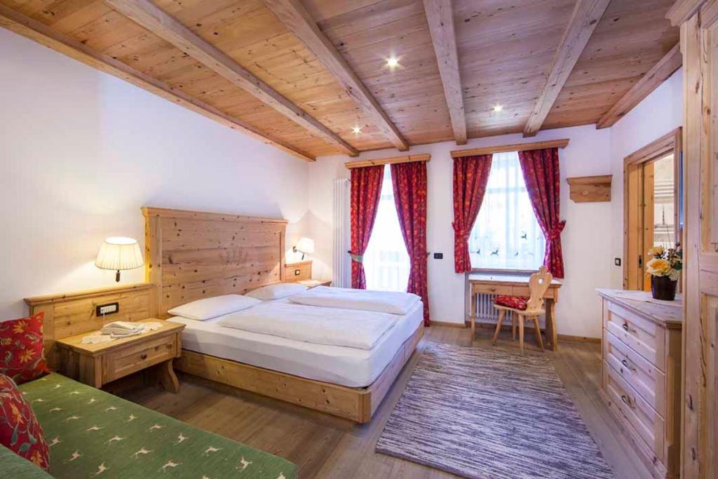 Postel nebo postele na pokoji v ubytování Hotel Corona Krone