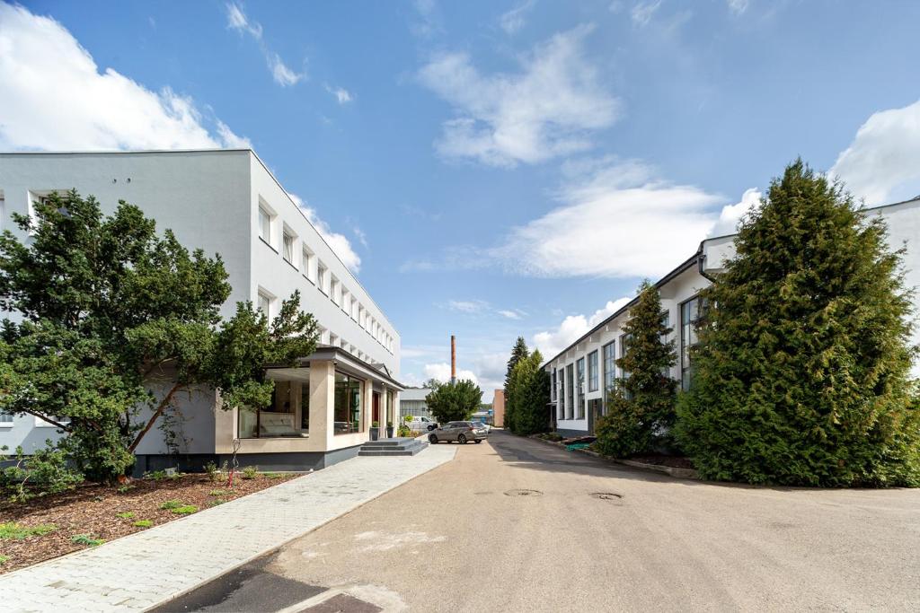 an empty street in front of a white building at Hotel Na Vývoji in Vlašim