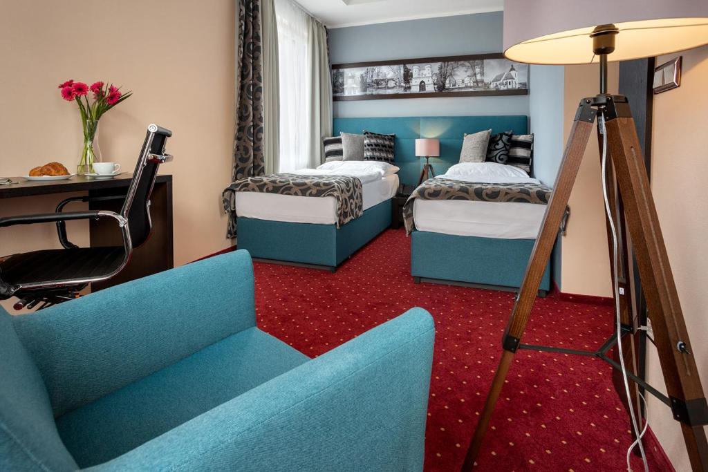 Postel nebo postele na pokoji v ubytování Hotel Na Vývoji