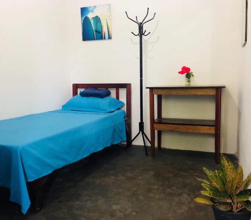 Postel nebo postele na pokoji v ubytování Tres Islas Hostel