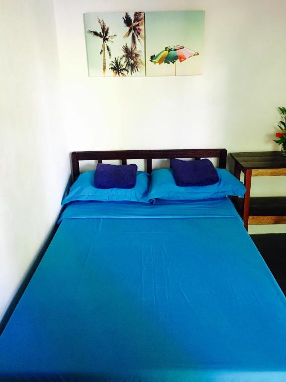 Postel nebo postele na pokoji v ubytování Tres Islas Hostel
