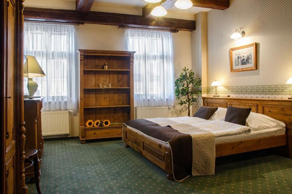 Postel nebo postele na pokoji v ubytování Hotel & Caffe Silesia