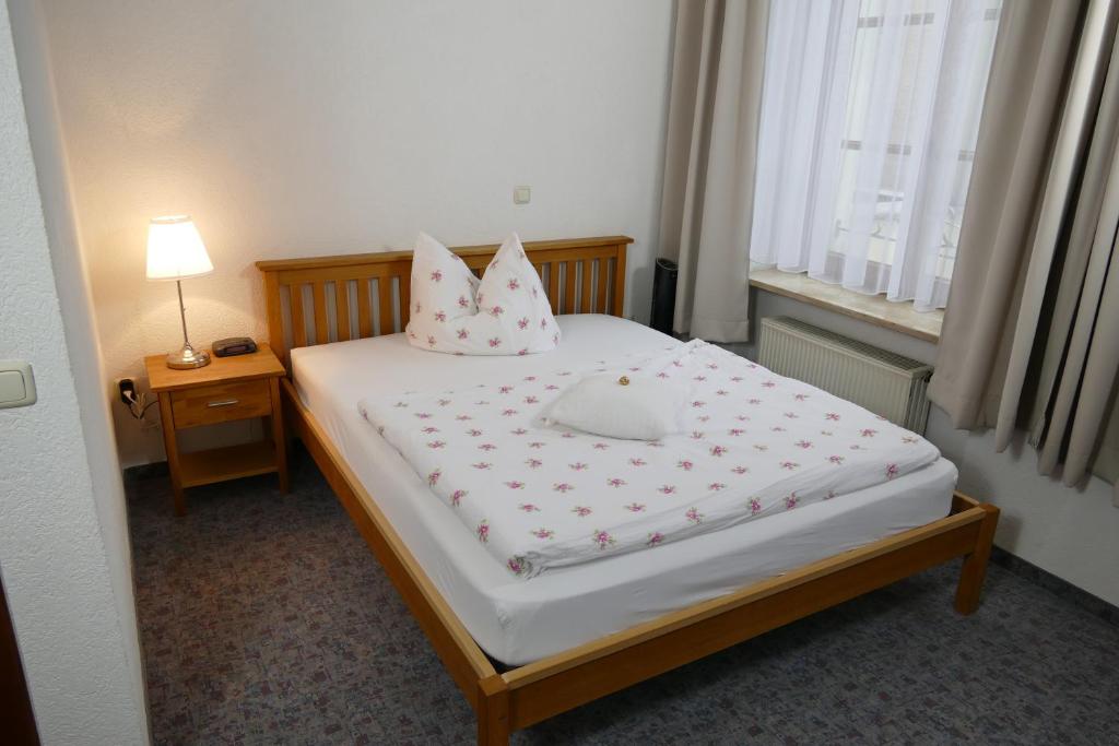 Postel nebo postele na pokoji v ubytování Hotel Meridian