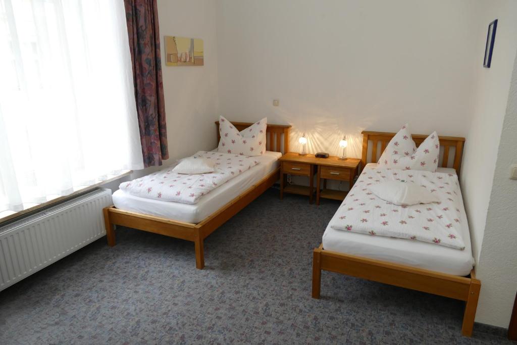 Postel nebo postele na pokoji v ubytování Hotel Meridian
