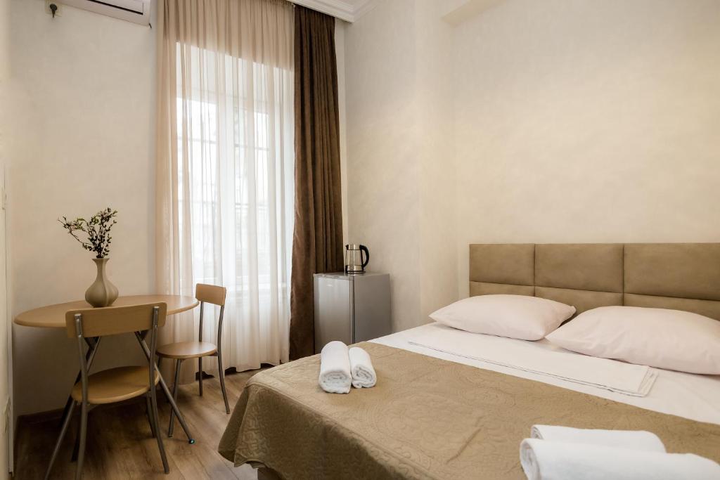 Postel nebo postele na pokoji v ubytování Star Hotel