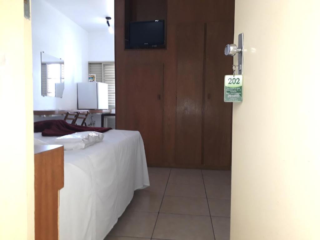 Postel nebo postele na pokoji v ubytování Minas Palace Hotel