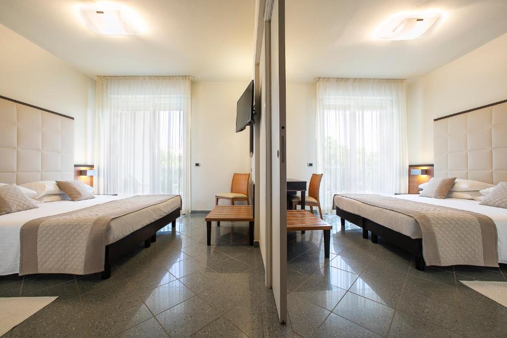 Posteľ alebo postele v izbe v ubytovaní Park Hotel Ermitage Resort & Spa