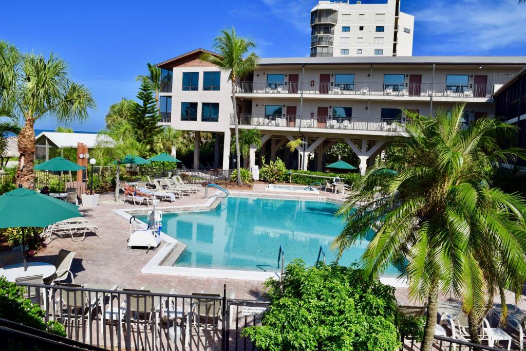 a view of a hotel with a swimming pool at Caribbean Beach Club in Fort Myers Beach