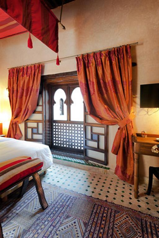 Postel nebo postele na pokoji v ubytování Algilà Fes Riad Medina Charme Hotel