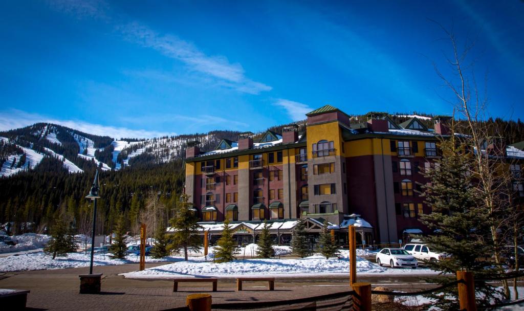 a hotel in the mountains with snow on the ground at The Vintage Hotel in Winter Park