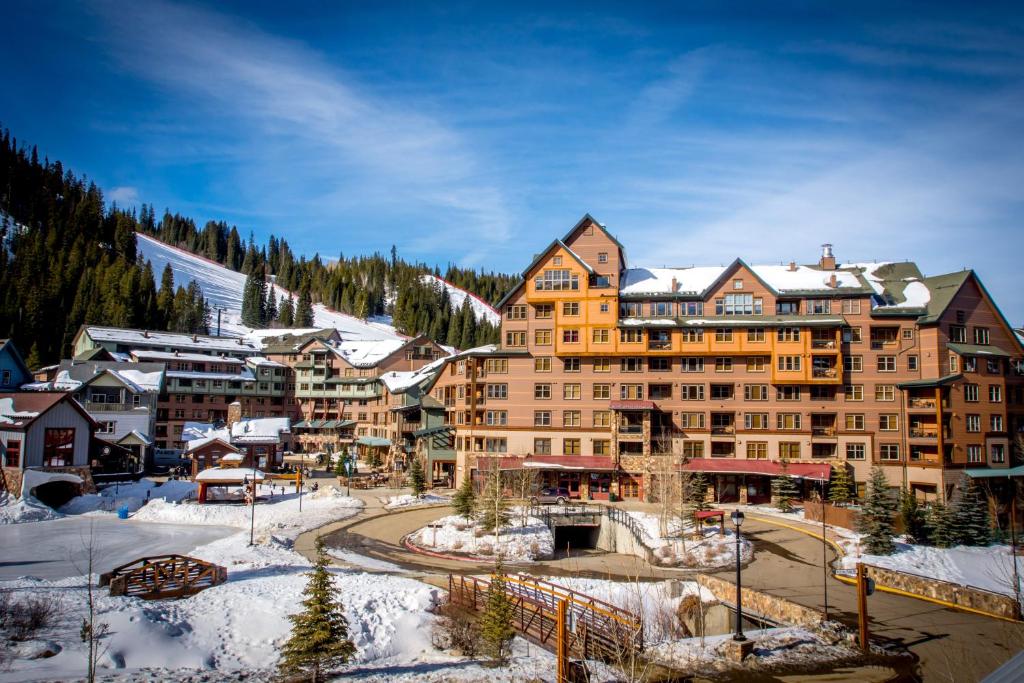 a large building with a ski lodge on top of it at Zephyr Mountain Lodge in Winter Park