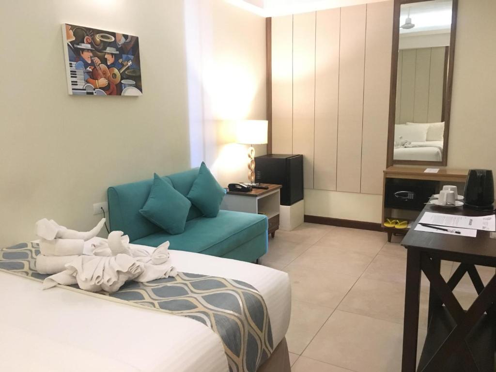 Postel nebo postele na pokoji v ubytování Belian Hotel
