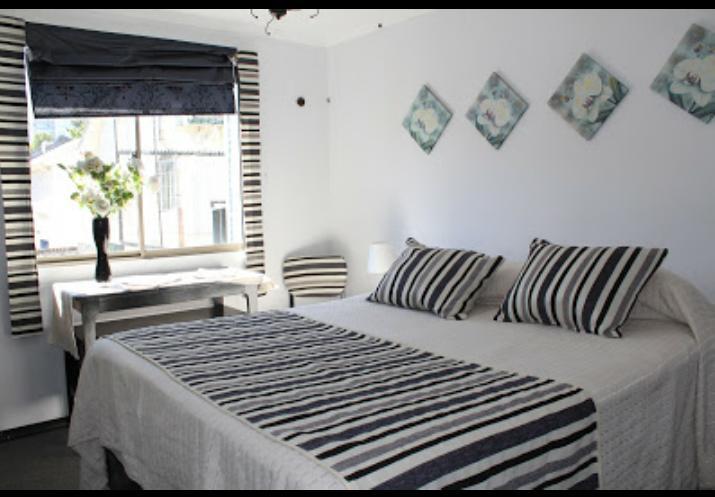 Postel nebo postele na pokoji v ubytování Hotel Maquehue