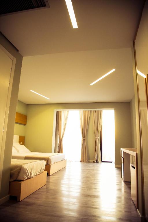 Postel nebo postele na pokoji v ubytování Hotel Bologna