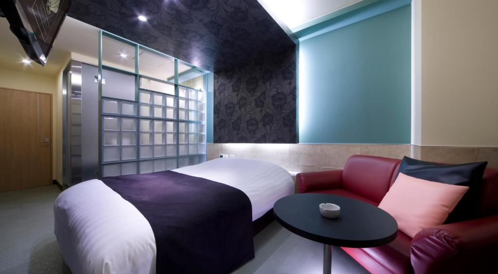 Postel nebo postele na pokoji v ubytování Hotel Glow Yokkaichi (Adult Only)