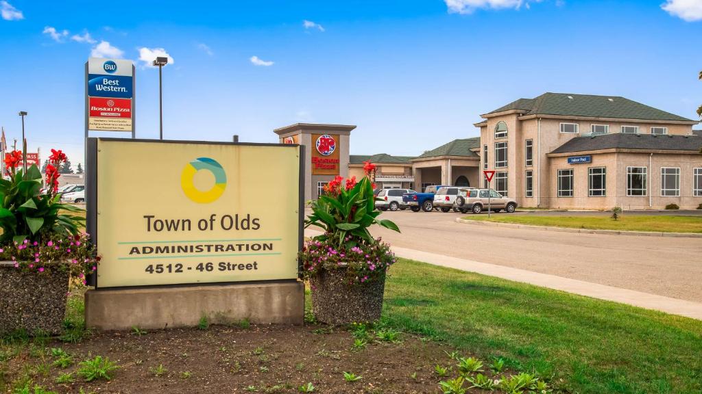 a town of owls administration sign in front of a building at Best Western of Olds in Olds